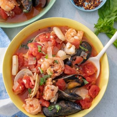 Seafood stew in serving bowl.