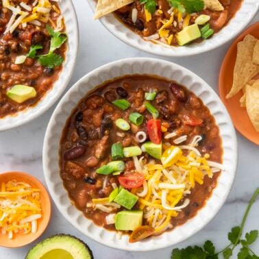 Four bean chili topped with cheese.