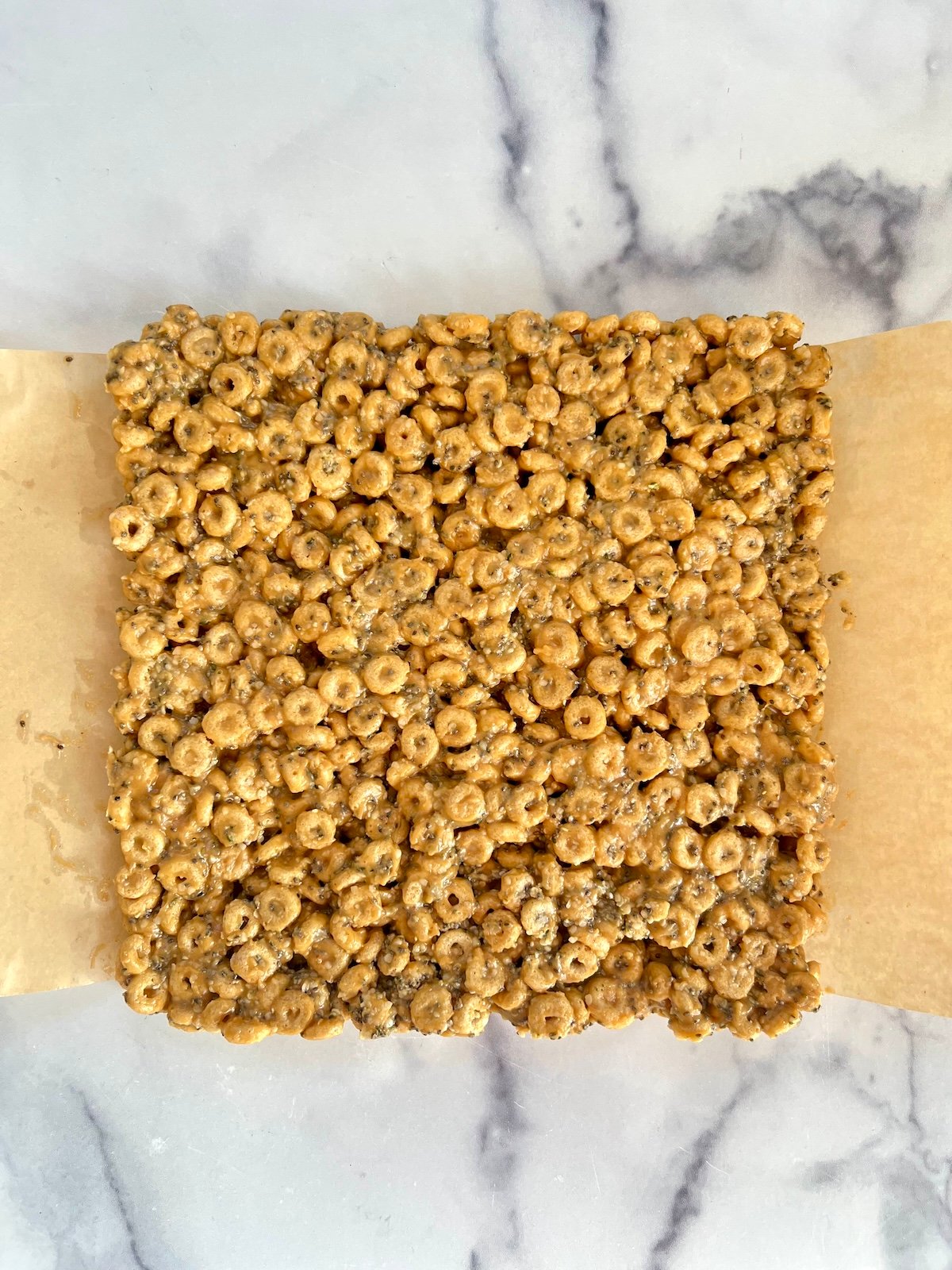 Cooled cereal bar slab before cutting into squares.