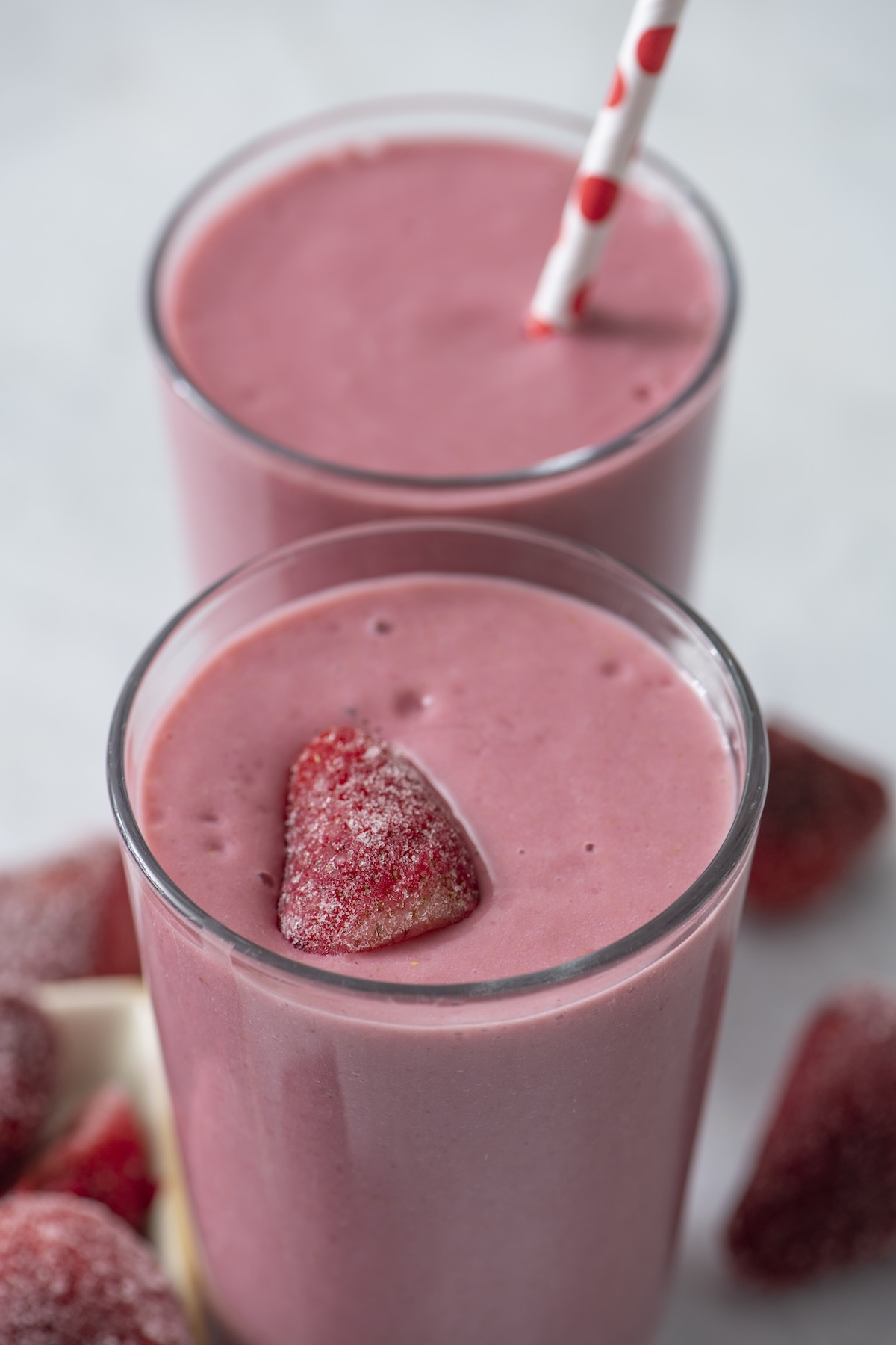 Two double berry smoothies in glasses.