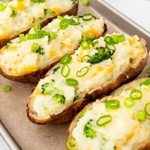 Twice baked potatoes on a baking sheet.