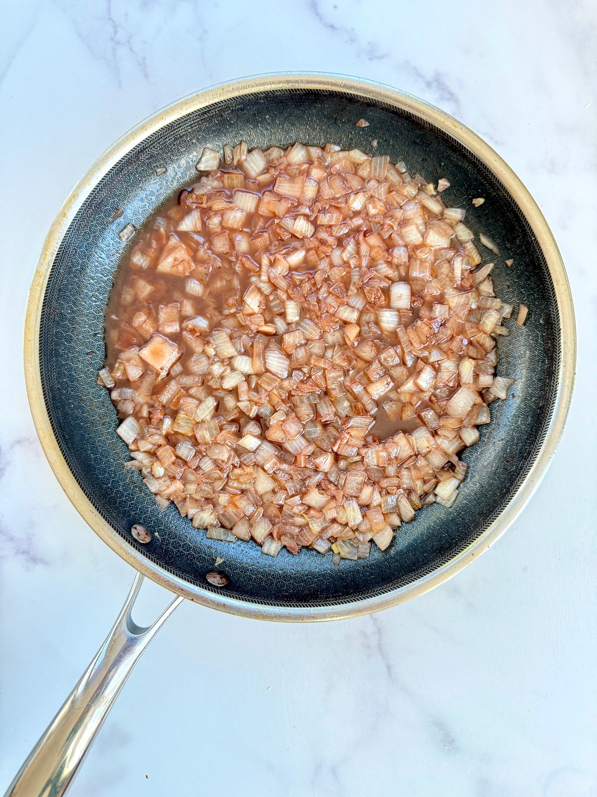 Deglazing the pan.
