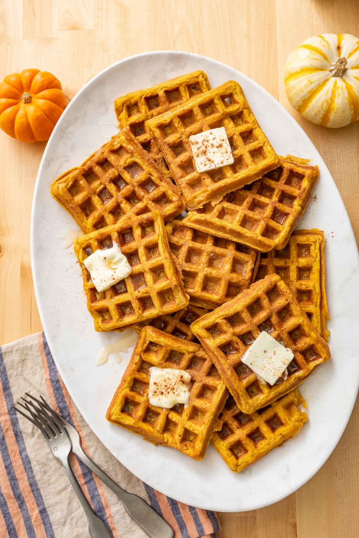 Pumpkin waffles served on a platter.