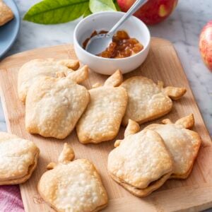 Apple pie turnovers on a serving board.