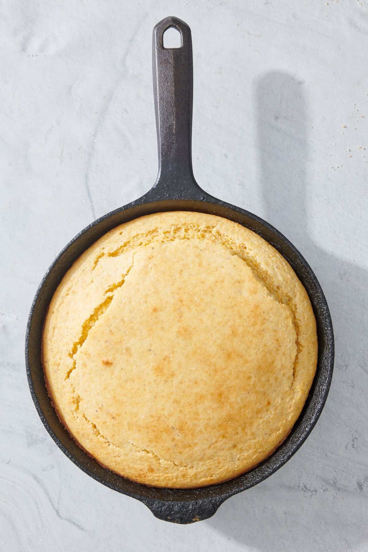 Basic cornbread baked in a cast iron skillet.