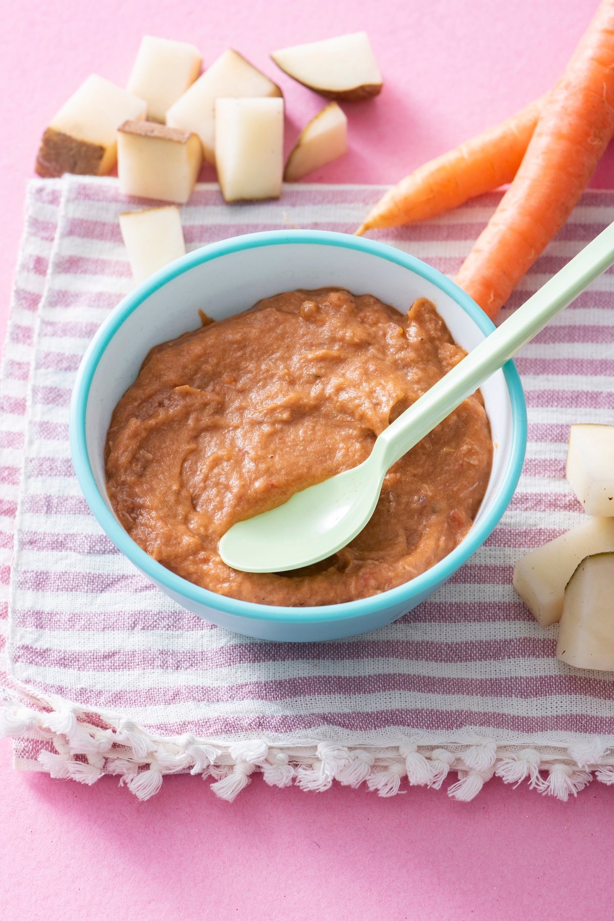 Baby beef stew in a blue bowl.