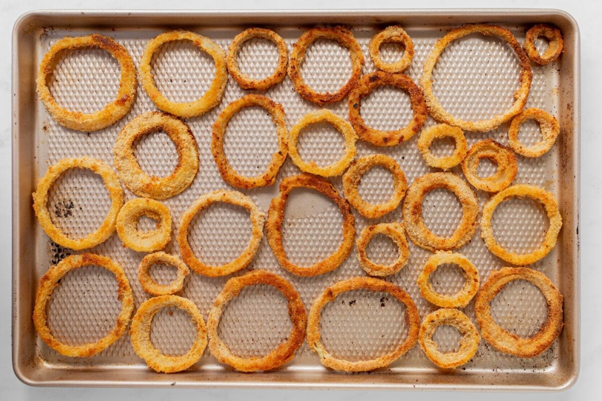 Onion rings on a baking sheet.