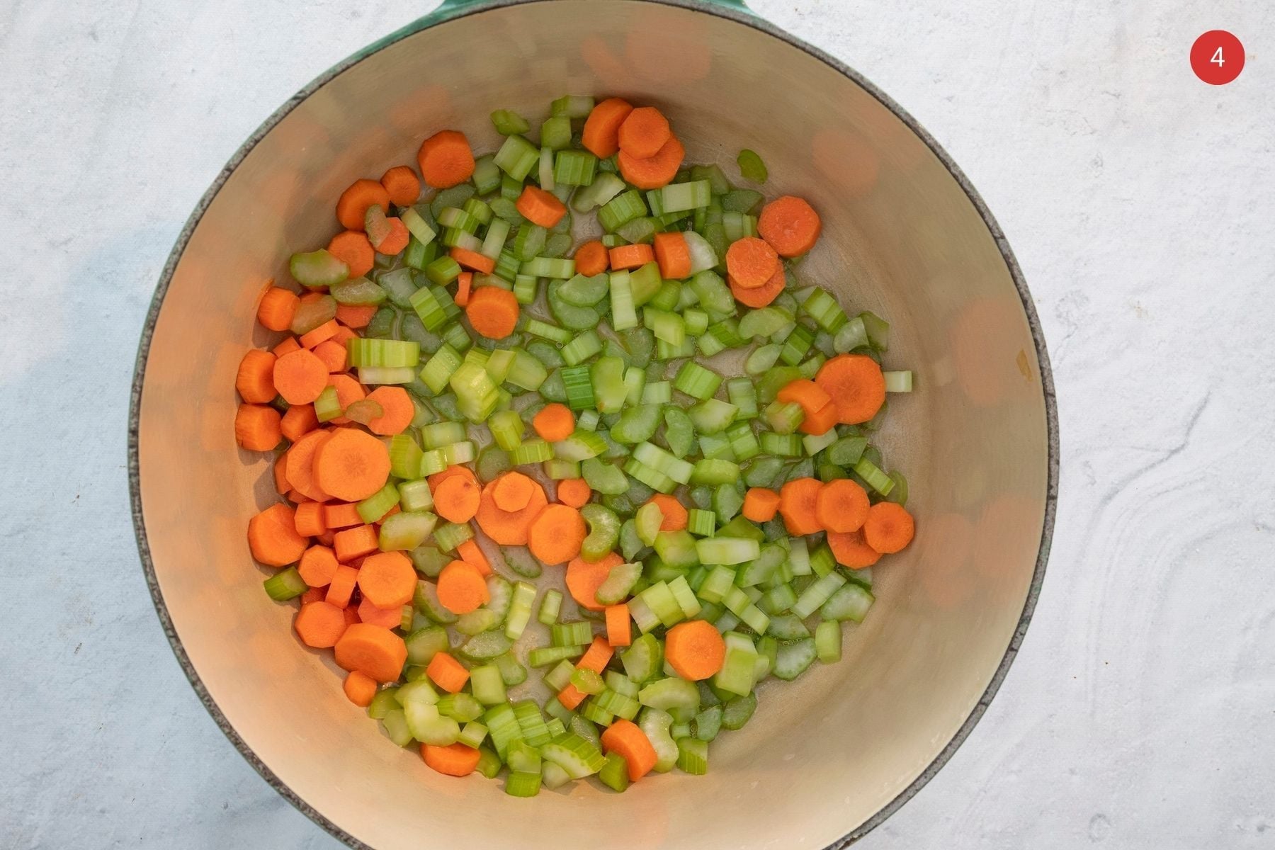 Celery and carrots in a large pot.
