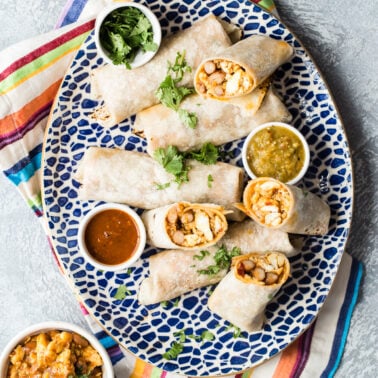 Breakfast burritos on a serving platter.
