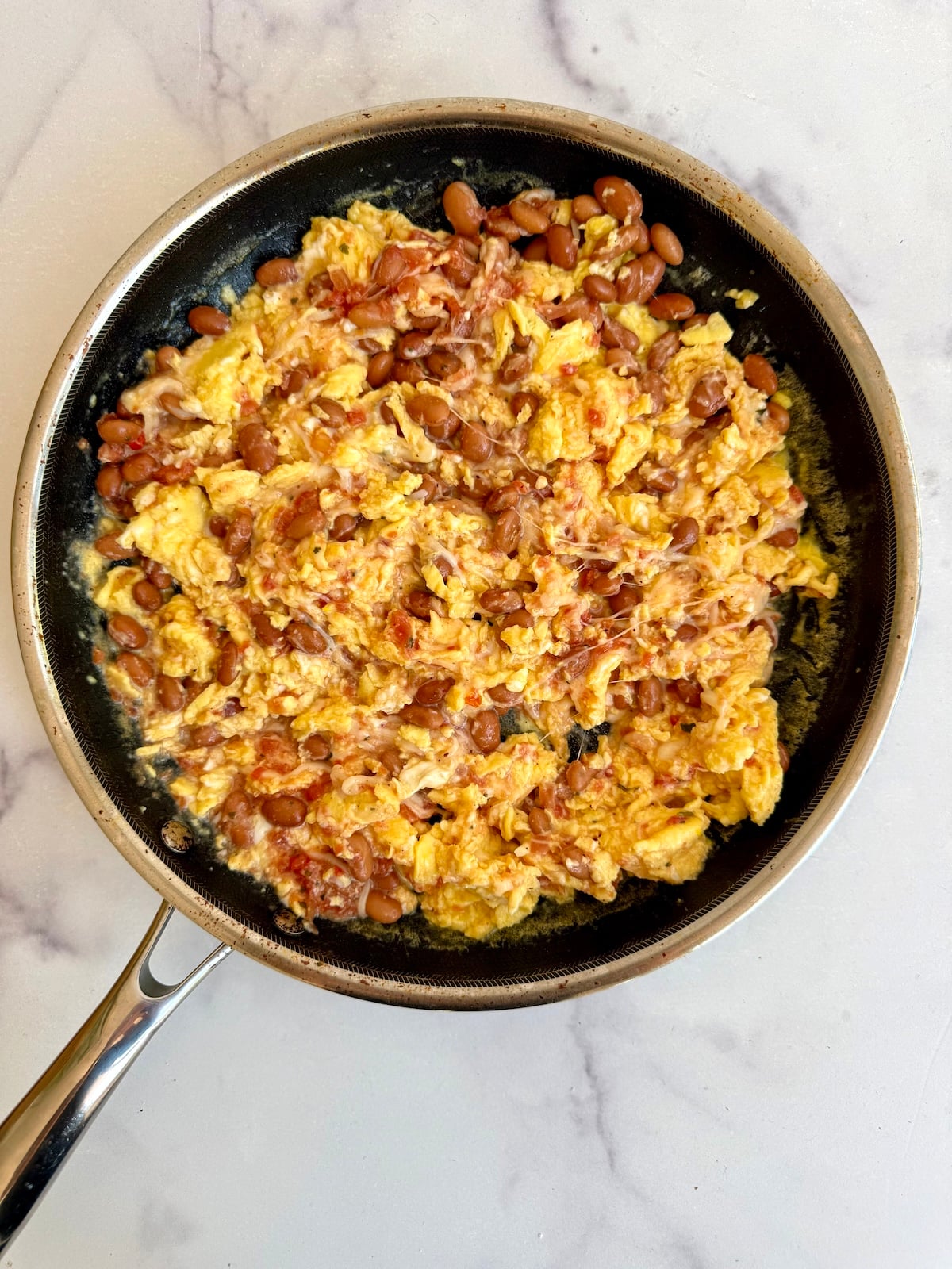 Breakfast burrito filling in a saute pan.