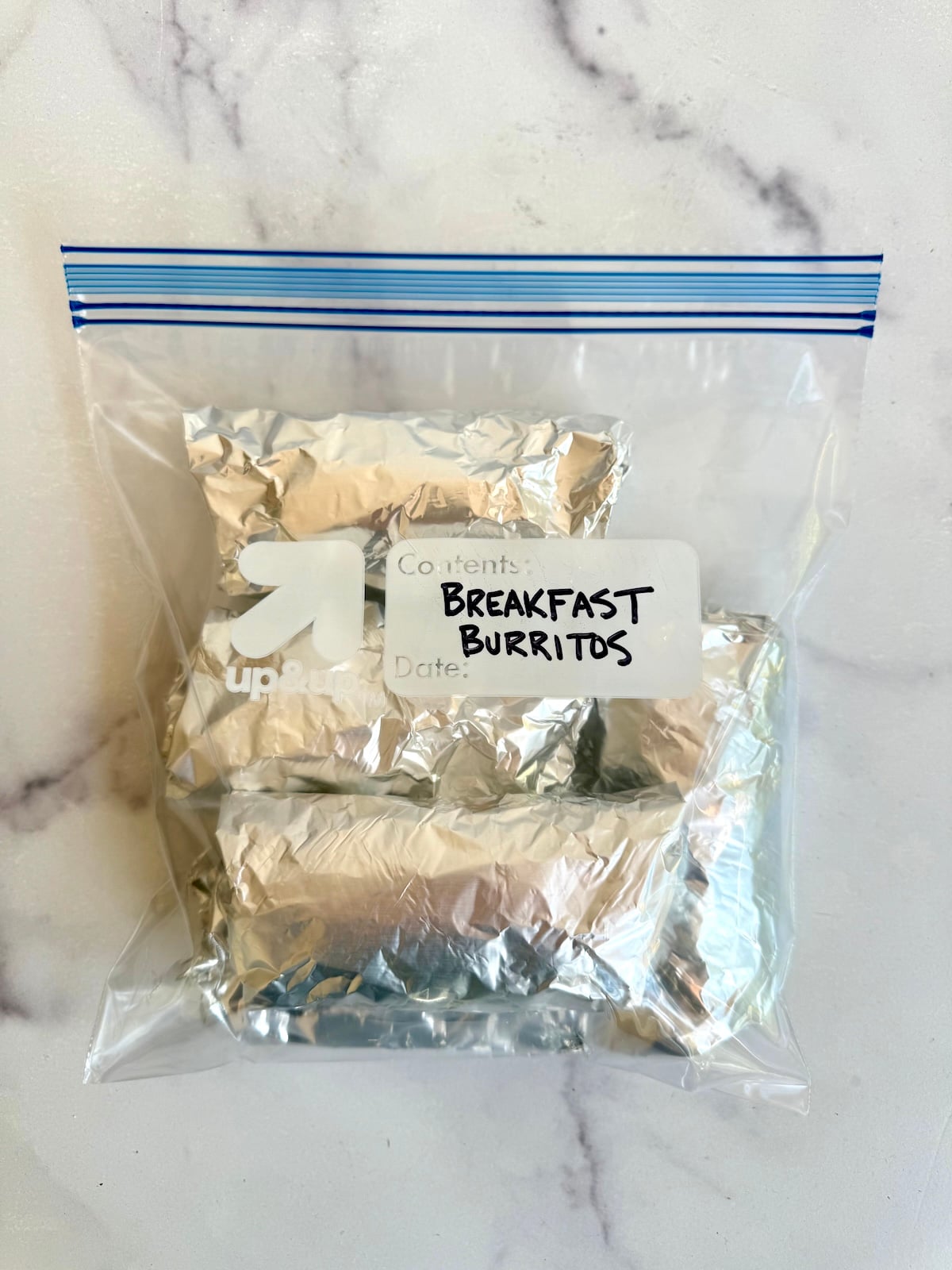 Make ahead breakfast burritos wrapped in foil and stored in a freezer bag.