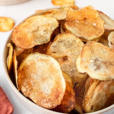 A bowl of homemade oven baked potato chips.
