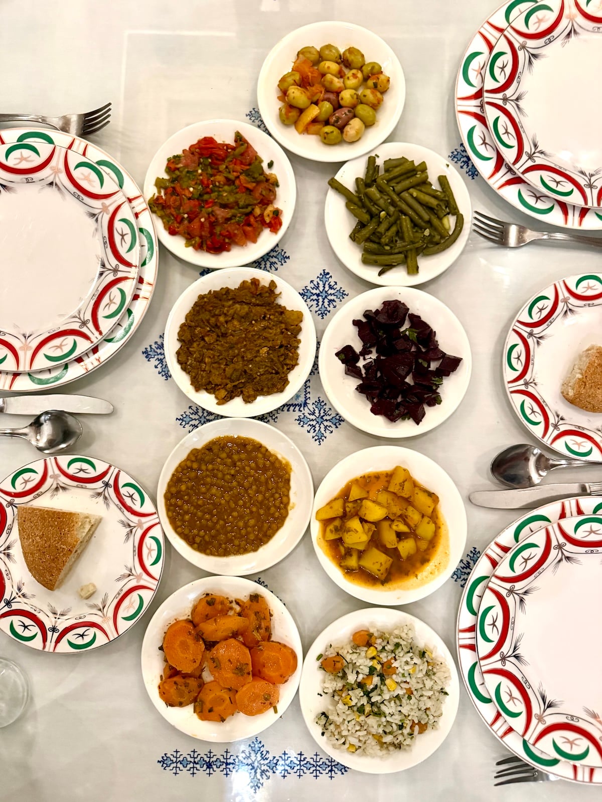 Overhead flatlay of traditional Moroccan salads and small dishes on a decorative plate.