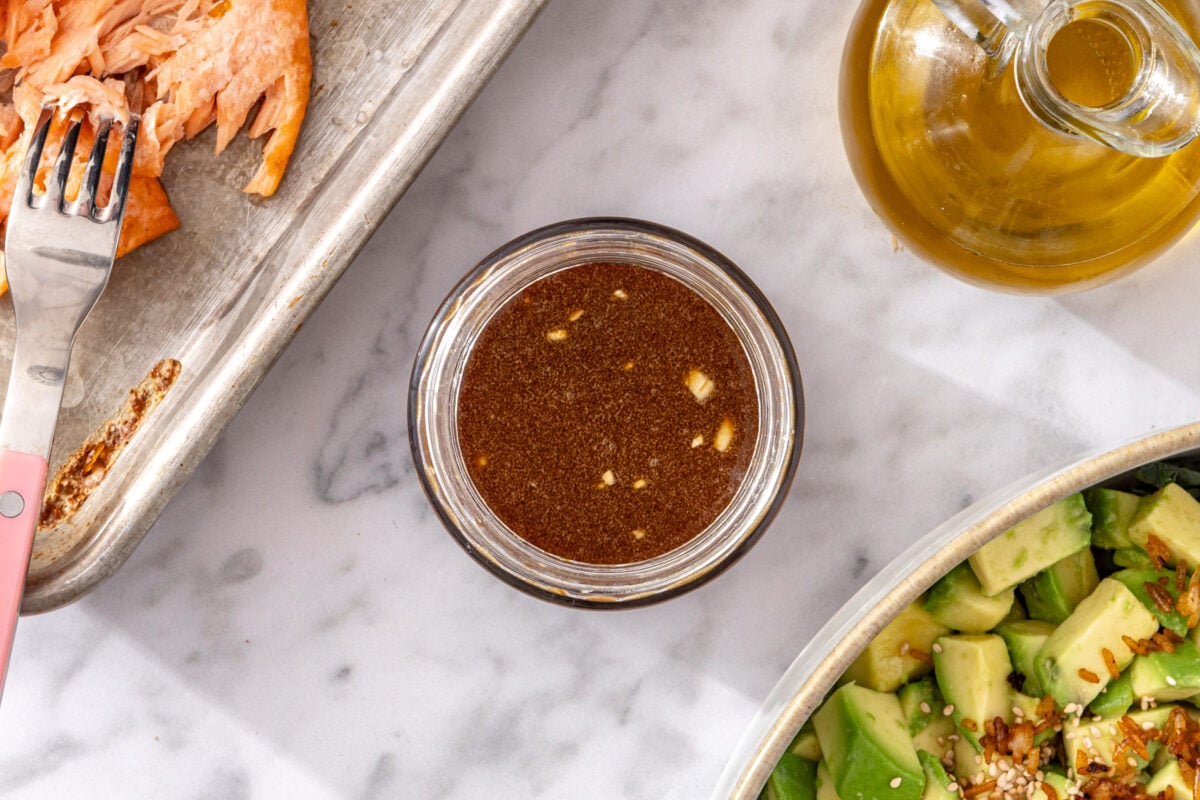Sesame soy dressing shaken and ready to pour over crispy rice salmon salad.